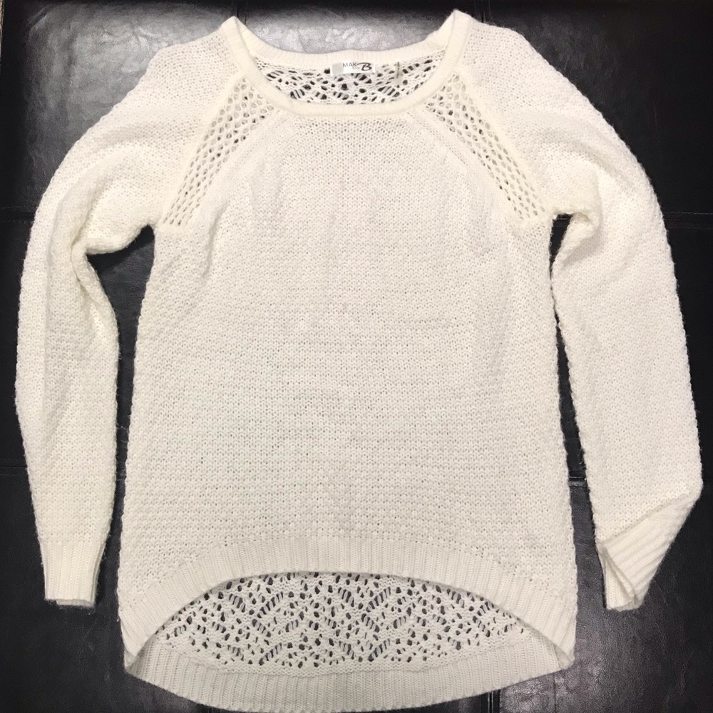 Creme sweater with bigger holes back.